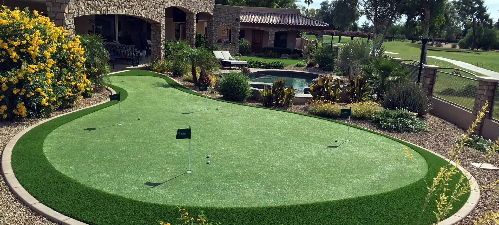 Backyard turf golf green installed by SYNLawn