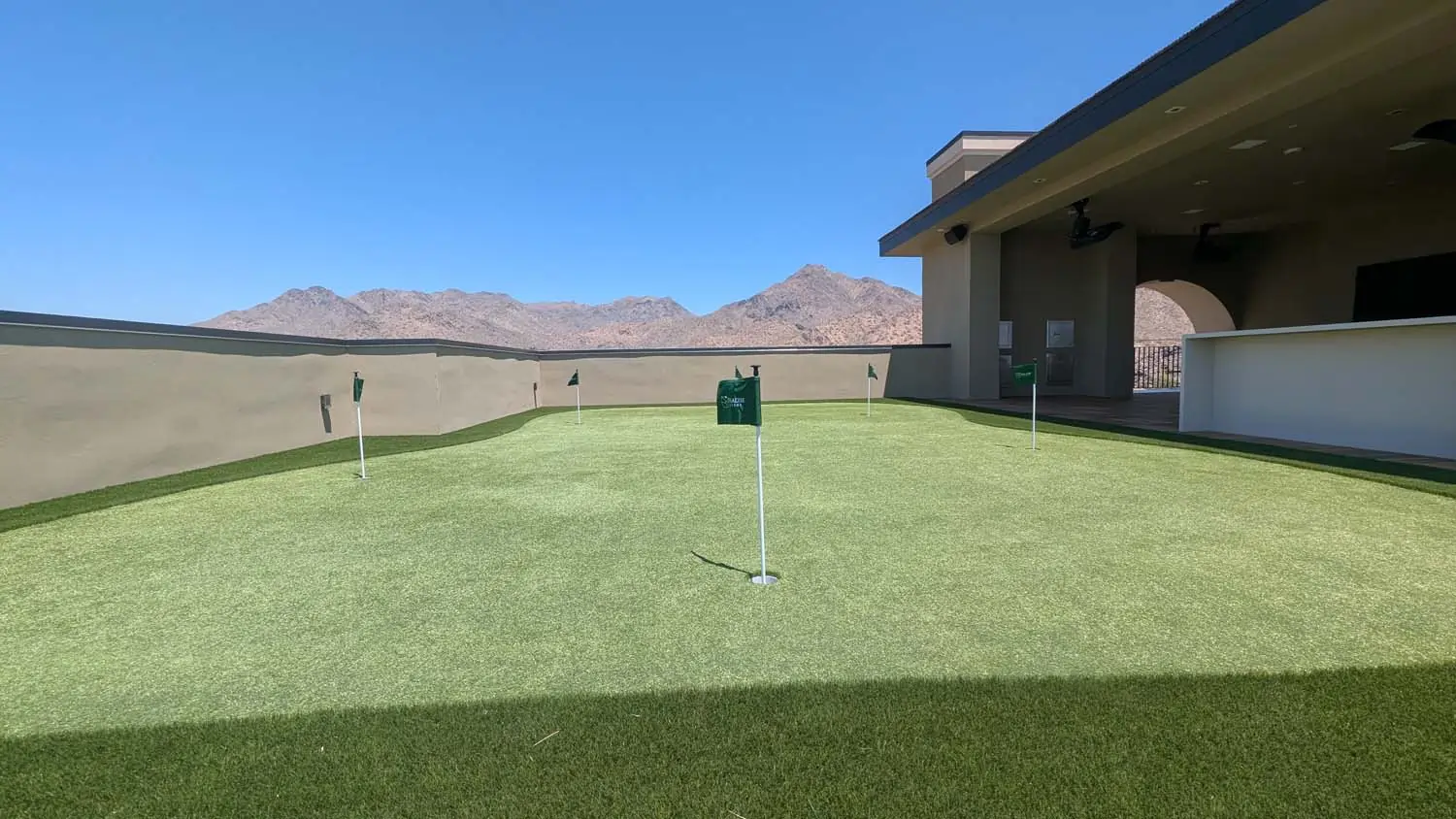 Rooftop backyard golf green installed by Paradise Greens
